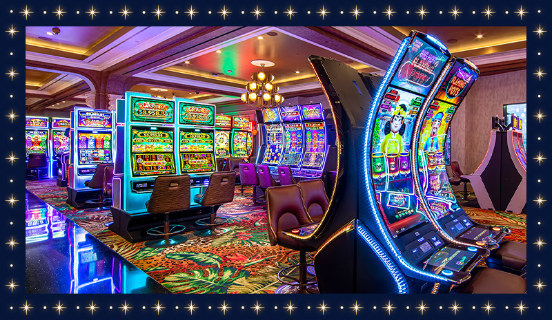 A brightly lit casino floor filled with colorful slot machines and empty chairs sprawls across patterned carpet, leading to nearby rooms where excitement awaits.