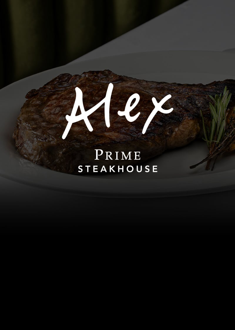 A grilled steak on a Siegel’s 1941 plate with text reading Alex Prime Steakhouse.